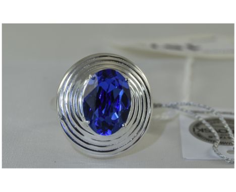 Swarovski 'Sapphire' Crystal Solitaire Ring, an oval cut sapphire colour Swarovski crystal, equivalent to 5.25cts of gemstone
