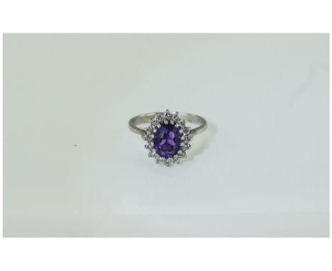 18ct White Gold Set Amethyst and Diamond Cluster Ring. The Central Amethyst of Excellent Colour, Surrounded by 18 Diamonds of