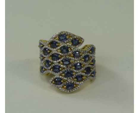 Sapphire Tile Pattern Ring, comprising 5.25cts of oval cut blue sapphires set in a mosaic style in 14ct gold vermeil and silv