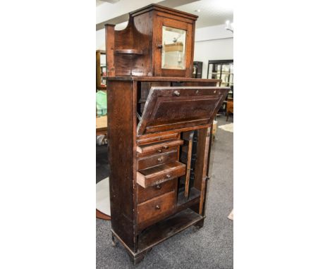 Late 19th Early 20thC Oak Dentists "ASH" Cabinet Mirrored Cupboard Door Above A Fall Front And Seven Graduating Short Drawers