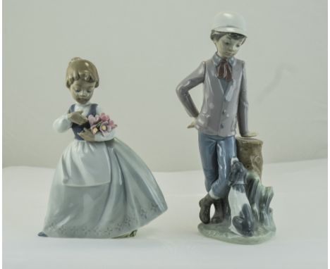 Nao by Lladro Figure ( 2 ) In Total. Young Boy with Dog. 9 Inches High. Young Girl With Basket of Flowers. 7.5 Inches High. E