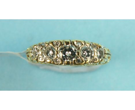 A diamond ring set five brilliant cut diamonds with diamond points between in 18ct yellow gold mount, size K, 4.4g.