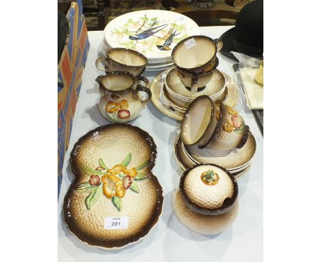 Twenty-two pieces of Carltonware tea ware with raised floral decoration and seven hand-painted plates decorated with birds by