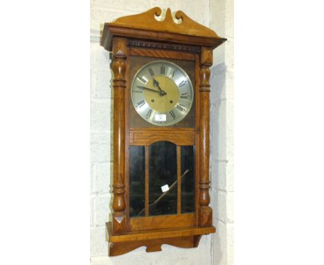 An oak-cased chiming wall clock, 85cm high, an oak-cased chiming mantel clock and an oak circular tray on folding stand, (3).