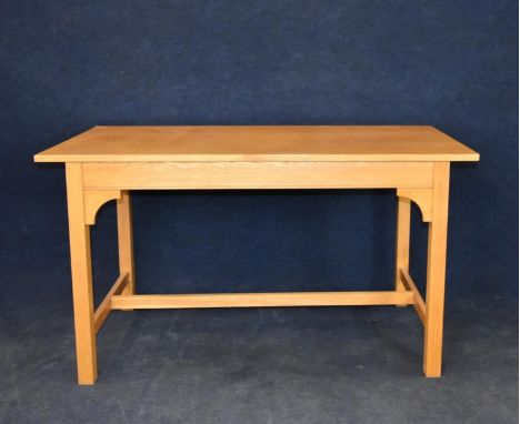 A light oak centre or side table. H.76 W.137 D.68.5cm.