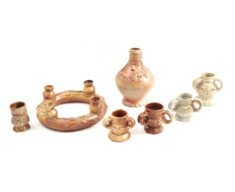 7 earthenware objects including pointed nose jar, pointed nose pots with 3 handles, vase and ring candlestick, 20th century, 
