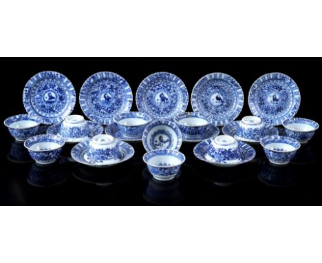 12 porcelain cups and 11 saucers with contoured open rim and blue decor of fool in floral surroundings, marked with Linzhi, C