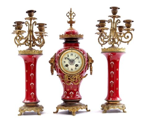 3-piece clock set with red earthenware, clock is 44 cm high, the 5-light candlesticks also 44 cm high (bell and pendulum miss