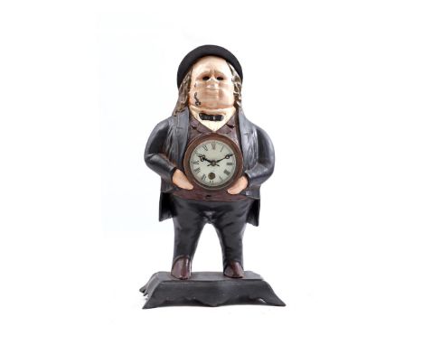 Bradley &amp; Hubbard cast iron table clock in the shape of a person in a costume and hat with movable eyes, 38 cm high