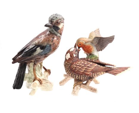 Goebel earthenware statue of a jay, 23 cm high and Goebel sculpture group of a feeding bird, 17 cm high