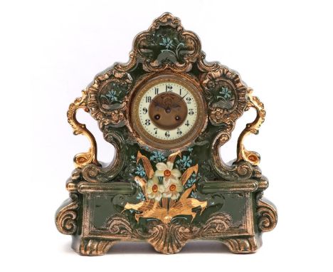 Classic table clock in a decorated earthenware case, 45 cm high (manco missing)