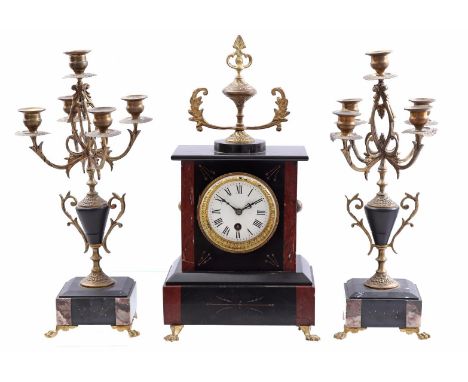 Marble mantel clock with vase on top, standing on claw feet, 42 cm high, 22.5 cm wide and 2 5-light candlesticks (these did n