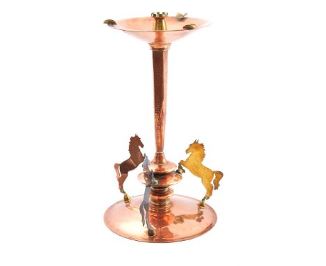 Copper candlestick with tower-shaped candle holder on top, ashtray section, hammered column and 3 horses at the base, 43 cm h