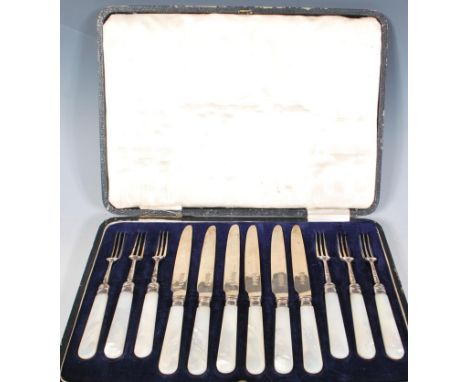 A cased set of early 20th Century Thomas Bradbury &amp; Sons silver cutlery / flatware having mother of pearl handles to incl