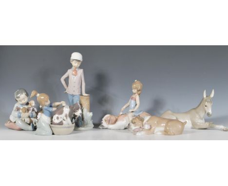 A collection of Lladro figurines to include a Nativity Donkey 5483,&nbsp;&nbsp;little girl brushing a large dog - Contented C