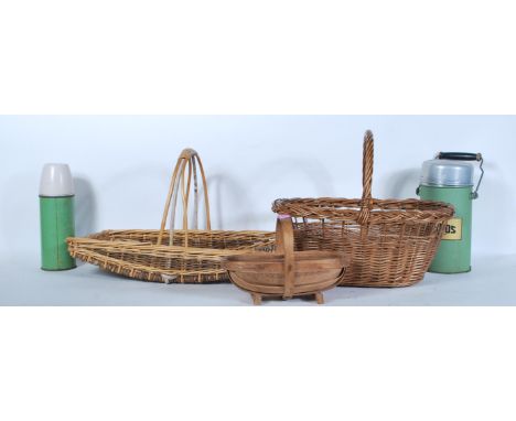 A collection of vintage 20th Century whicker work baskets and trugs together with a vintage Thermos flask and another.