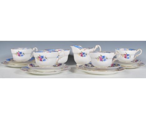 A vintage 20th Century part tea service by Paragon consisting of four cup, saucers and side plates (Four trios) sugar bowl an