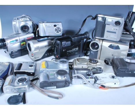 A collection of 20th Century digital cameras and equipment to include a Hitachi VM - E360E video camera, a Canon UC15 video c