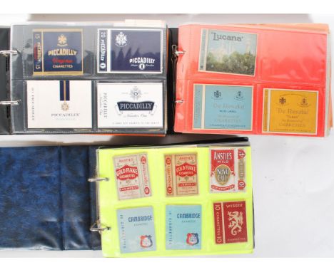 A collection of vintage 20th Century cigarette packets over three albums various brands to include Lucana, De Reszke Blue Lab