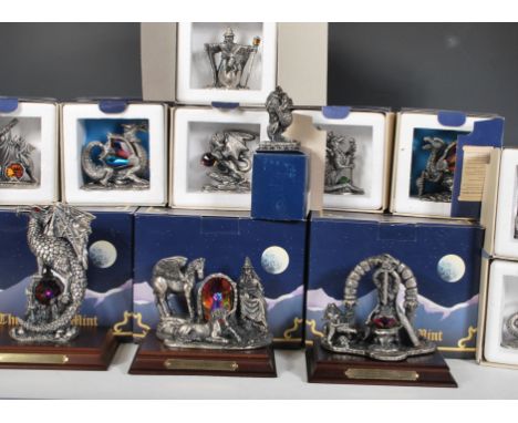 A collection of Myth and Magic Tudor Mint figurines to include the Earth Dragon, the Regal dragon, the Solar dragon, the Wron