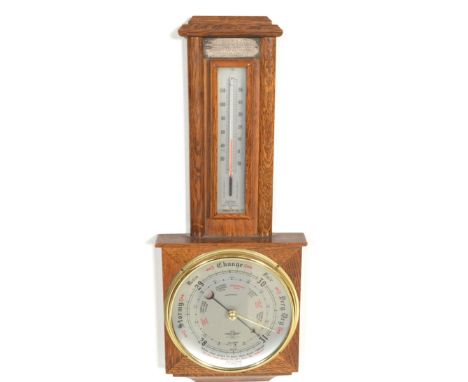 A mid Century oak cased banjo wall barometer&nbsp;having&nbsp;thermometer above. Makers mark for Shortland Smiths with silver