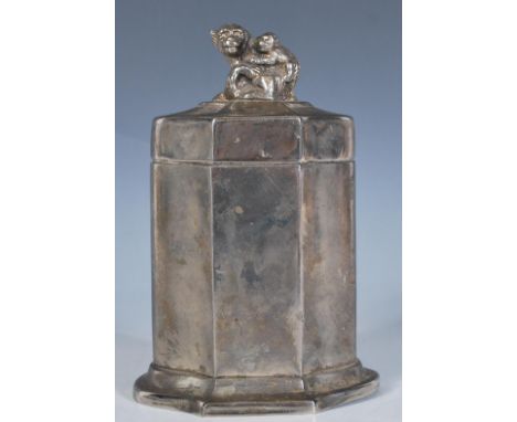 A 20th Century white metal tea caddy case having a cast finial the top in the form of a monkey with an infant on her back, fi