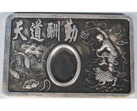 A 20th Century Chinese cast metal desk top inkwell having embossed decoration with a female figure, frog and koi carp with ch