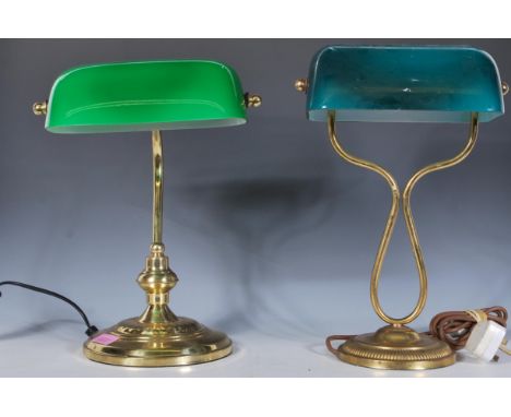 A 20th Century bankers desk lamp being raised on a round stepped base with a curved tubular neck and green glass shade togeth