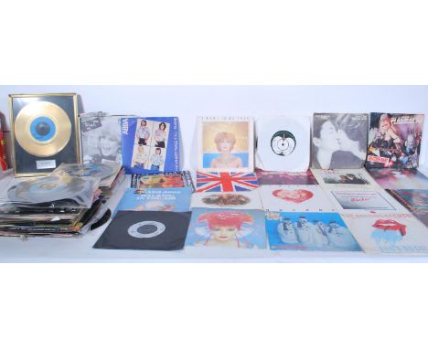 A collection of 45 RPM vinyl 7" singles from several artists to include a gold framed single by Blondie from the Blondie Fan 