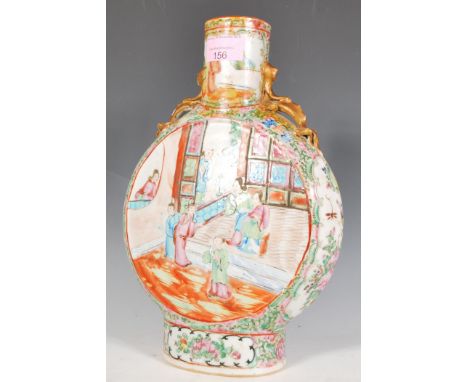 A 19th Century Chinese Canton famille rose moon flask decorated with interior narrative scenes to the central round panels, h