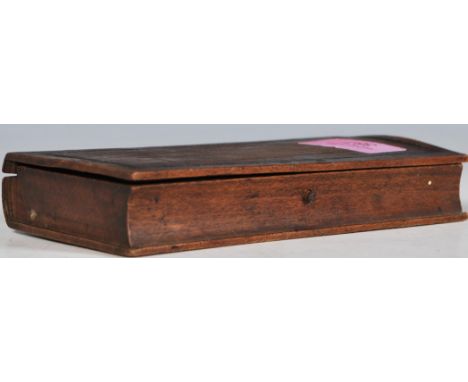 A set of 19th Century pocket apothecary balance scales set within a wooden case in the form of a book having a hand written p