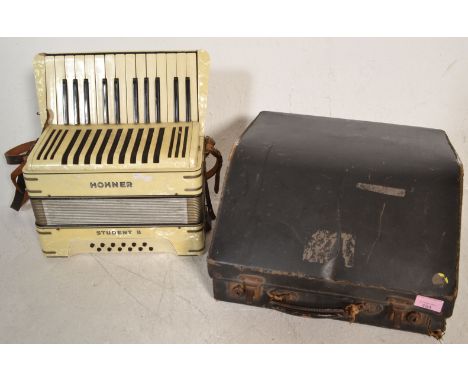 A vintage 20th Century Hohner Junior II accordion in original case, light pearlescent&nbsp; facia to the body with fitted lea