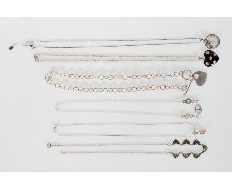 A selection of stamped 925 silver necklaces to include a toggle necklace with a heart pendant, a pendant set with a round cut