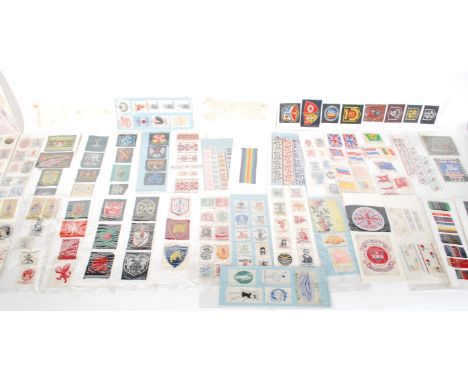 A collection of vintage 20th Century samples of woven clothing labels and ribbons from Cash's in Coventry, to include world f