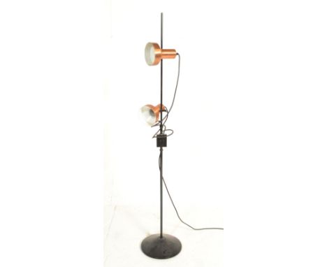 A retro 20th Century vintage floor standing standard lamp having twin copper colour spot lights on adjustable mounts raised o