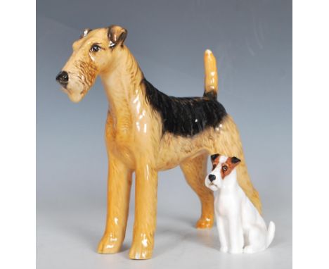 A 20th Century Beswick ceramic figurine in the form of a fox terrier painted in black and brown, marked Cast Iron Monarch wit