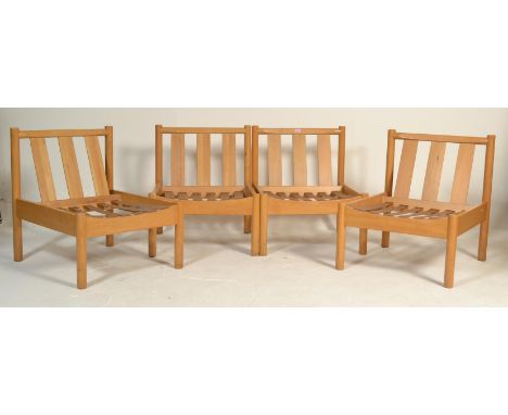 A set of 4 20th century&nbsp; retro Ercol solid beech wood blonde low lounge chairs, the chair fitted with webbing&nbsp; with
