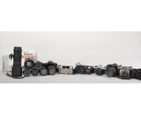 A collection of vintage 20th Century 35mm cameras and lenses to include a Cannon EOS 10, Cannon A-1 and Pentax MX, lenses to 