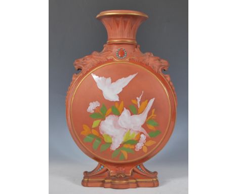 A 19th Century Victorian Watcombe Torquay terracotta moon flask, the central round body decorated with nesting birds raised o