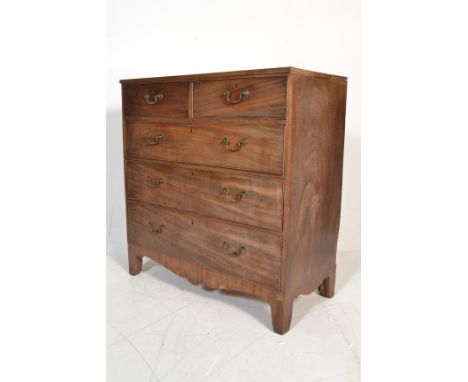 A 19th Century Georgian mahogany chest of drawers. The bank of two over three graduating drawers raised on bracket feet with 