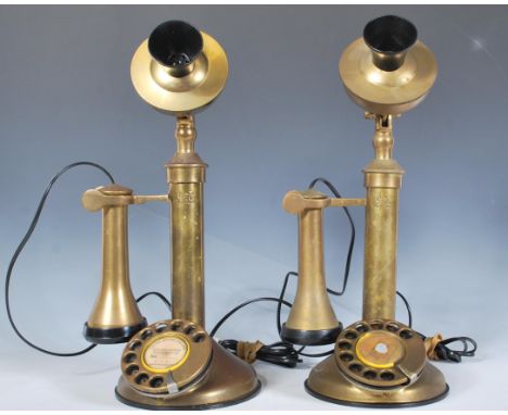 A pair of antique style stick brass telephones, ring dials to the circular bases and etched to the front G E C, wired ready t