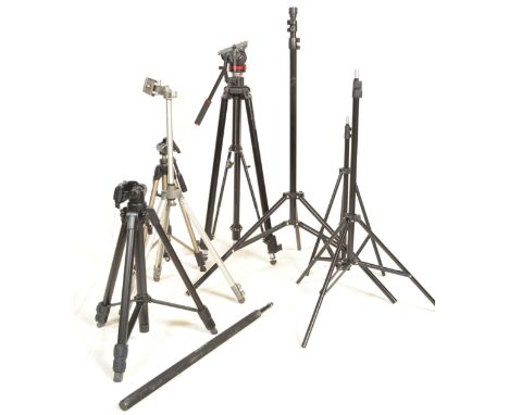 A collection of camera tripods of varying size and makes to include Manfrotto 117B with Bridging Technology, Star 62, Velbon 