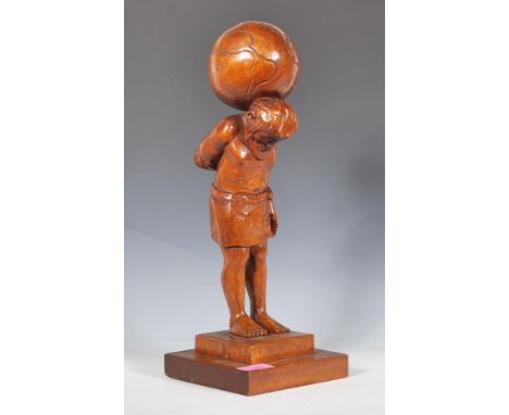 A 20th Century wooden carved oak lamp base in the form of a figure of Atlas raised on a square stepped base with a globe on h
