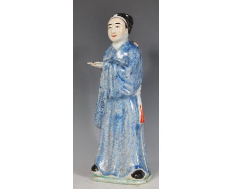 A 20th Century Chinese figure in the form of a scholar having a blue glazed robes with black scroll decoration. The scholar s