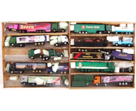 A collection of assorted believed 00 gauge model railway train set related diecast trucks to include mostly continental examp