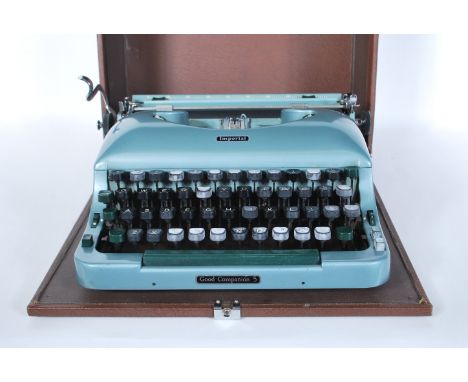 A vintage 20th Century Imperial Good Companion 5 portable typewriter, enamel body cased within its original carry case.