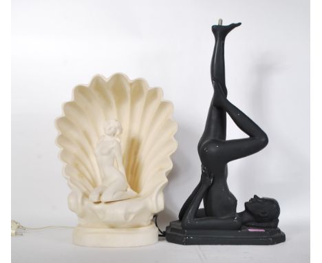 Two resin table lamps one in the form of a shell having a nude lady seated within the centre with light behind. Together with