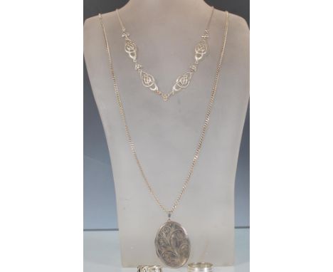 A selection of 20th Century silver jewellery to include a hallmarked oval locket having engraved scrolled decoration on a fla