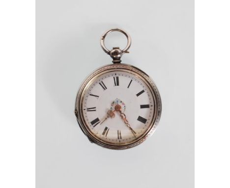 An early 19th Century Georgian silver hallmarked pocket watch having a decorative engraved case with central cartouche to ver