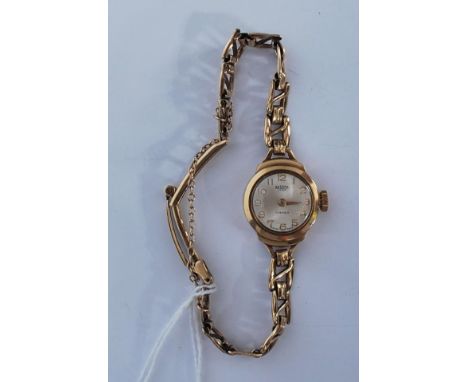 A vintage 20th Century ladies Medana Lever 17 jewels 9ct gold cocktail watch having a silvered dial with gilt arabic numerals